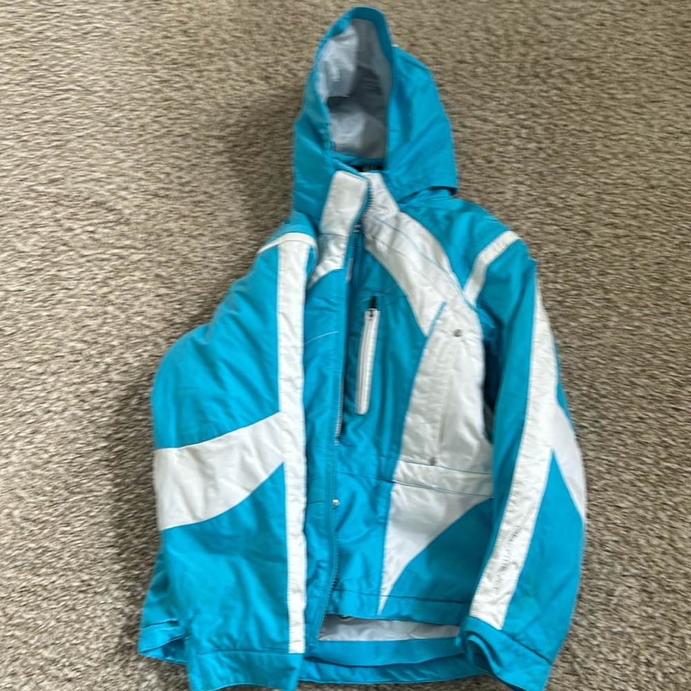 White and blue ski jacket